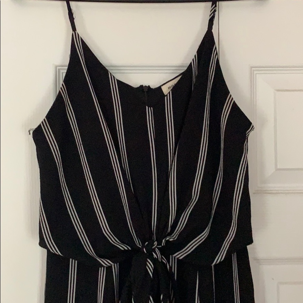 black and white body suit with slit up both legs